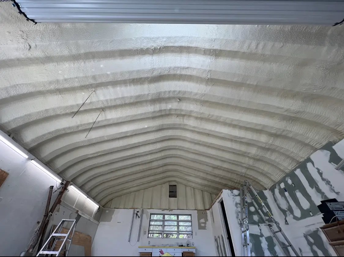 Spray polyurethane foam applied to the underside of a metal roof deck in Livonia